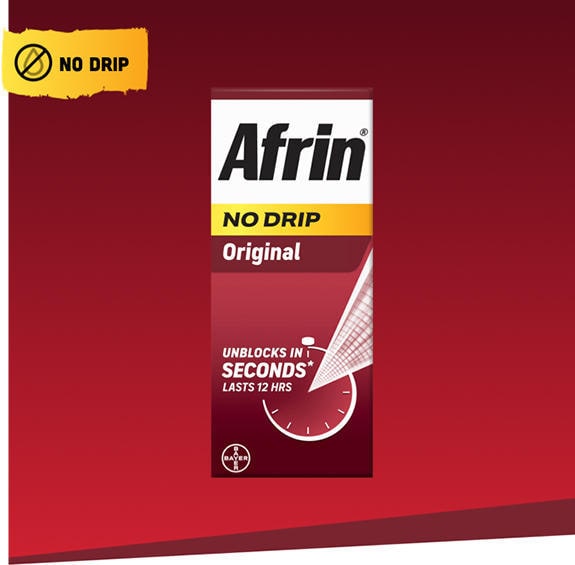 Afrin original no drip nasal spray packaging next to nasal spray bottle